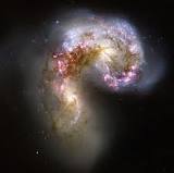 Antennae Galaxies. As two galaxies smash together, billions of stars are born.